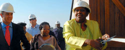 Minister of Minerals and Energy, Ms Buyelwa Sonjica, cuts the ribbon at the official plant opening